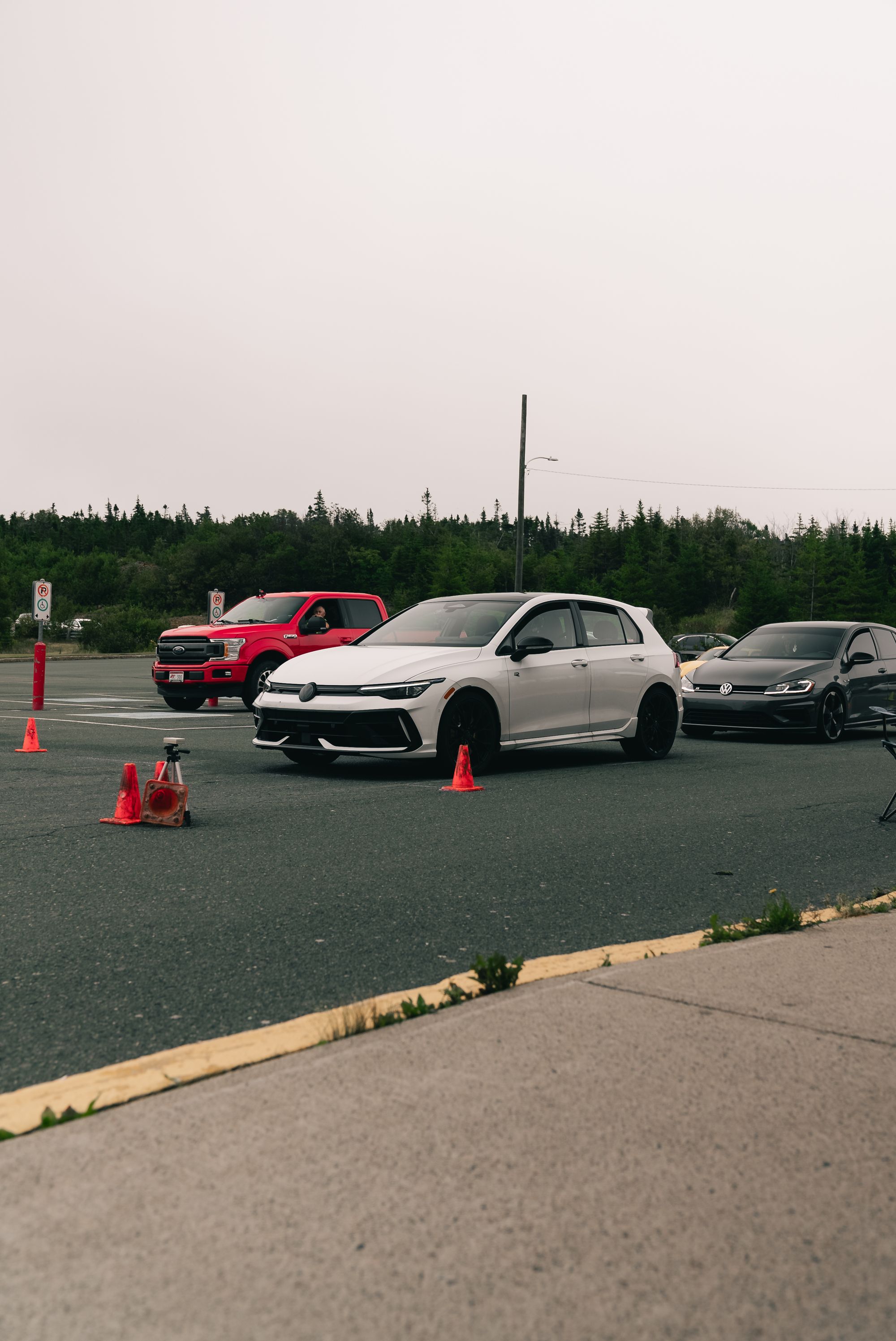 Training cars on an off-road course marked with cones